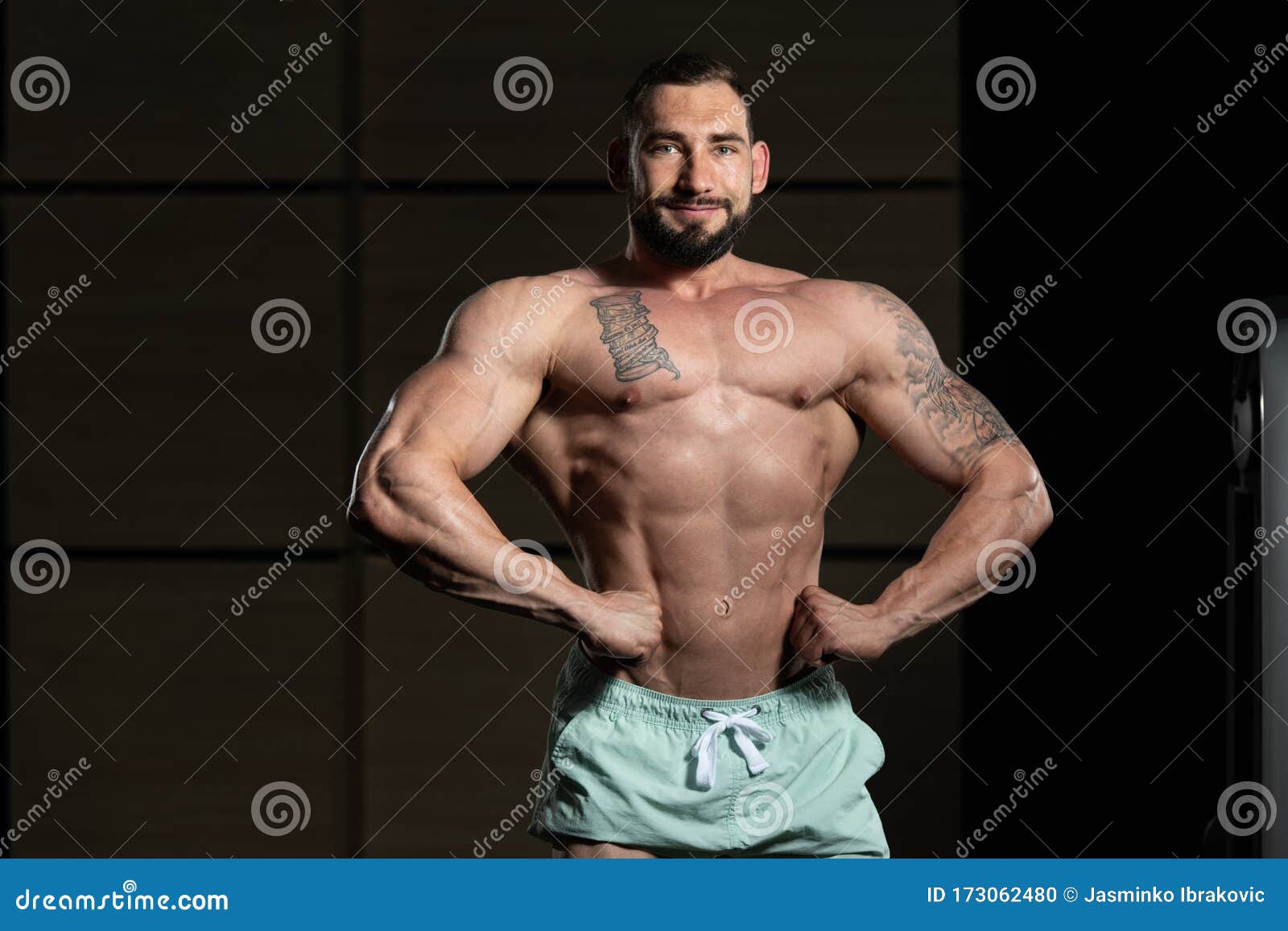 Handsome Muscular Man Flexing Muscles In Gym Stock Image 