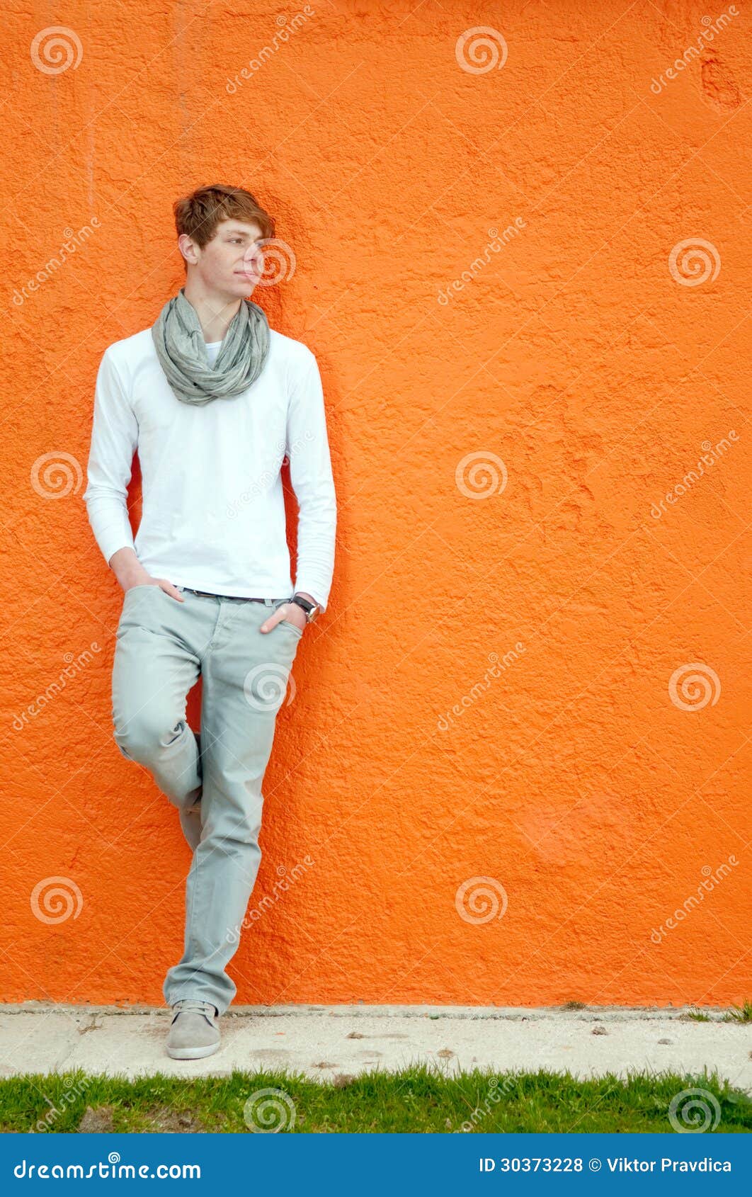 Young Man Standing by the Wall Stock Photo - Image of urban, carefree ...