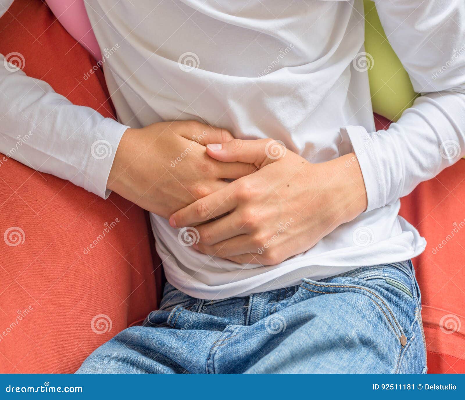 young man suffering from stomach ache, diarrhea, constipation, acid reflux, indigestion, nausea