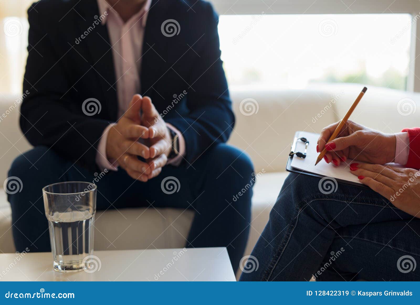 young man talking with therapist