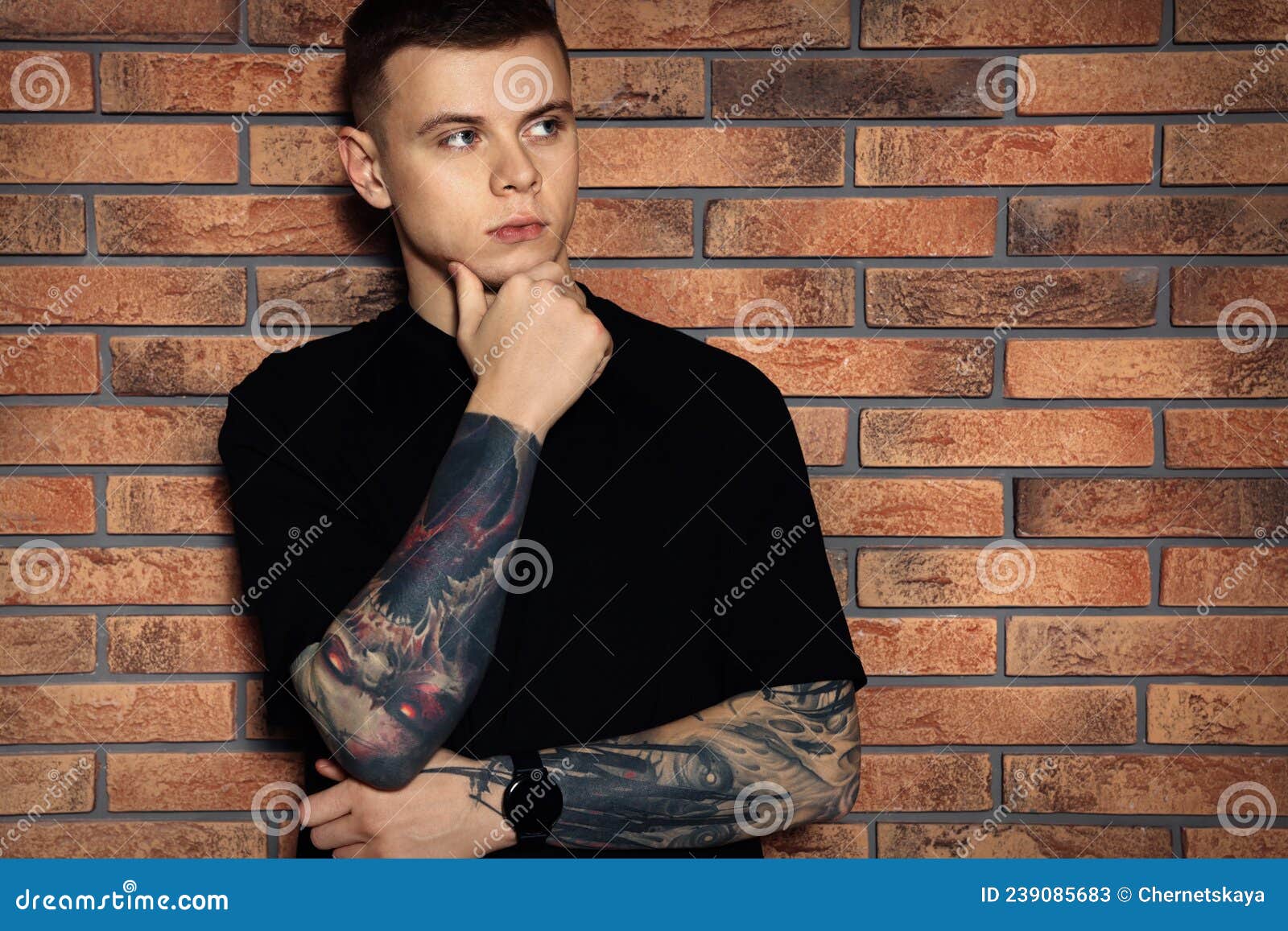 Young Man with Tattoos Near Brick Wall Stock Image - Image of body, space: 239085683