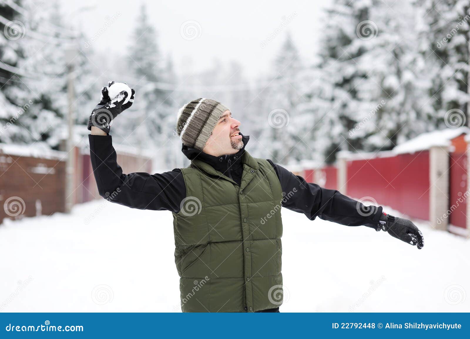 Young Man Throwing a Snowball Stock Photo Image of adult, cheerful 22792448
