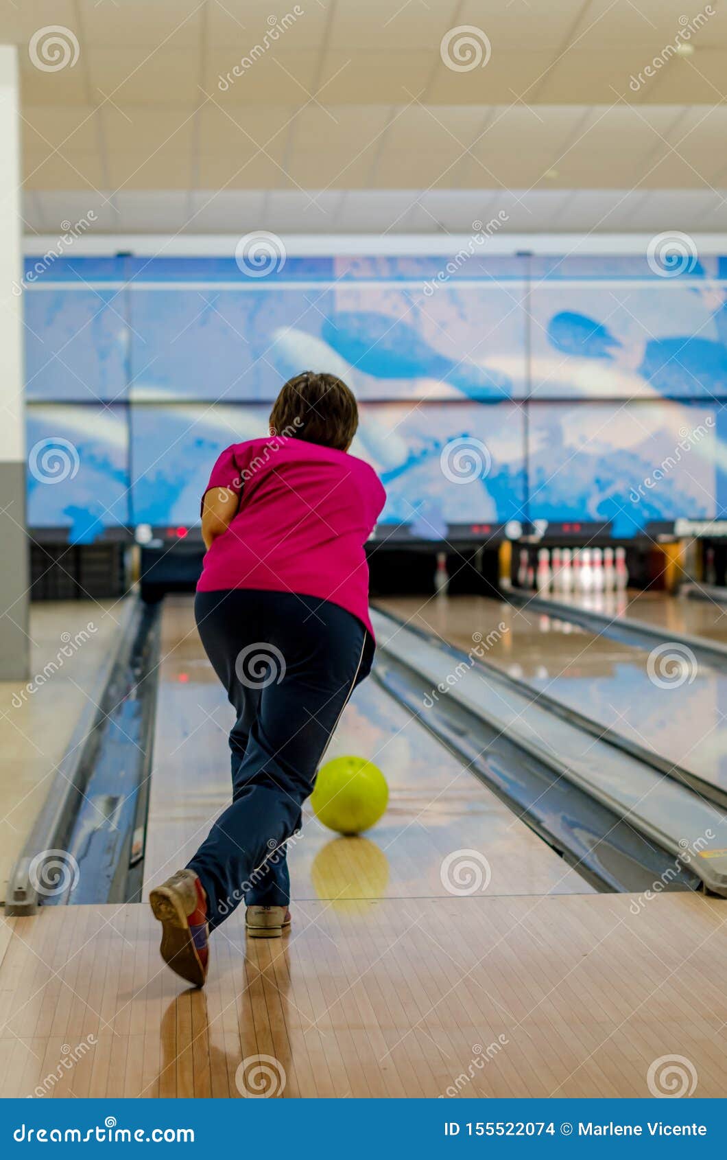 Young Man Throwing Yellow Ball in Bowling Game Stock Photo Image of