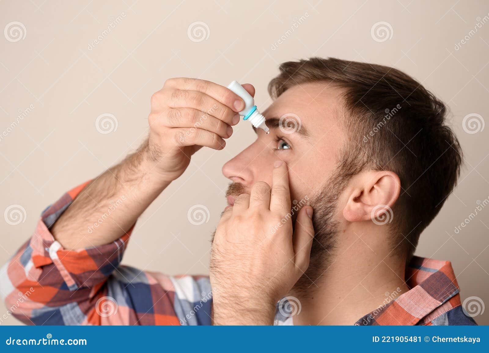 Young Man Using Eye Drops on Beige Stock Image Image of drop, male