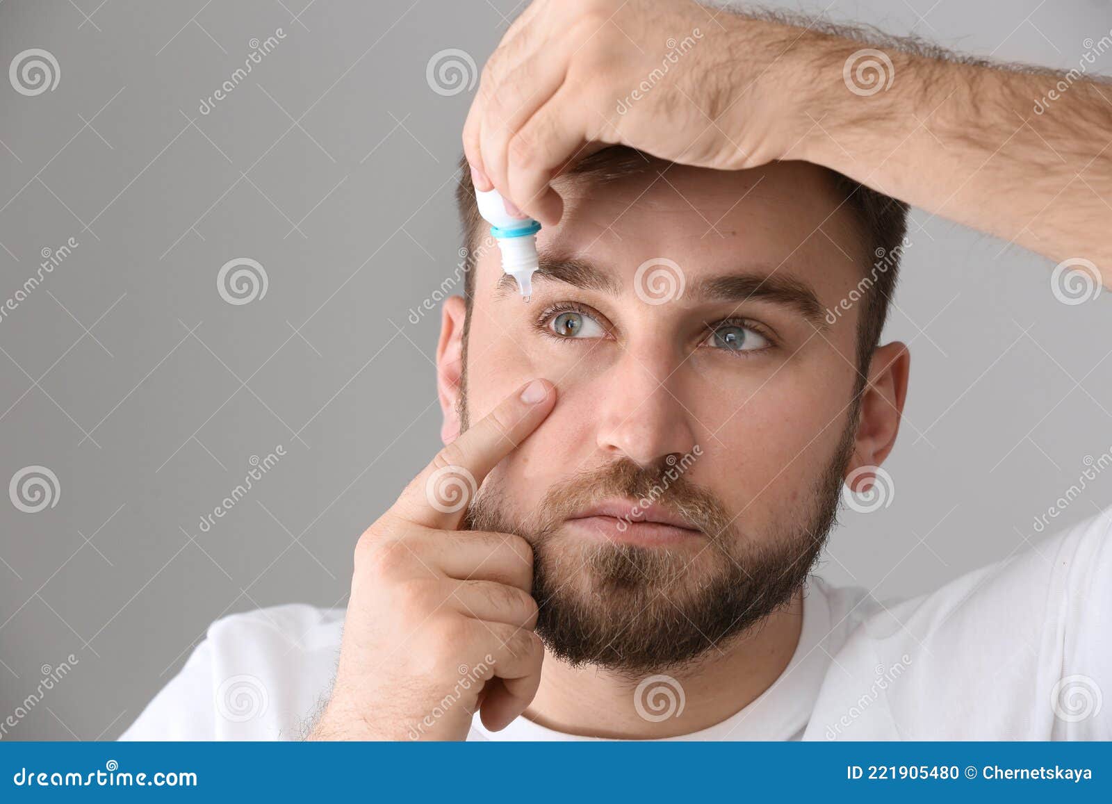 Young Man Using Eye Drops on Grey Background Stock Photo Image of