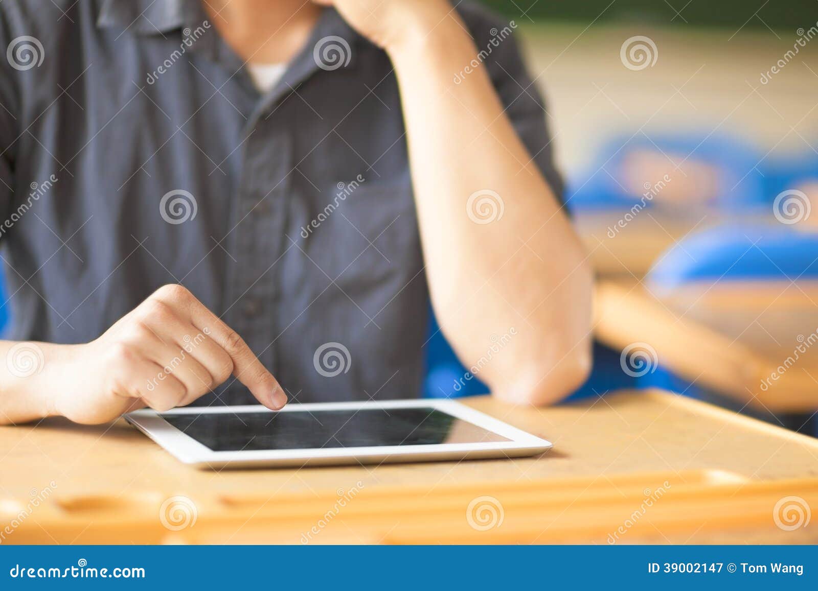 young man using a tablet or ipad