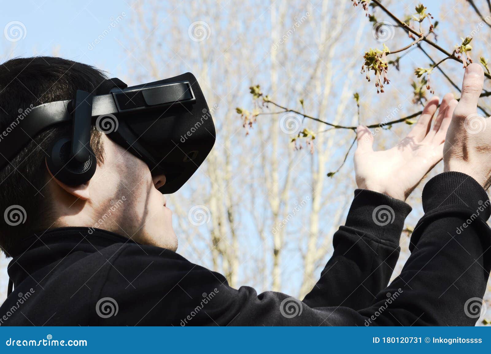 Young Man with a VR Headset Walks in Nature Stock Image Image of