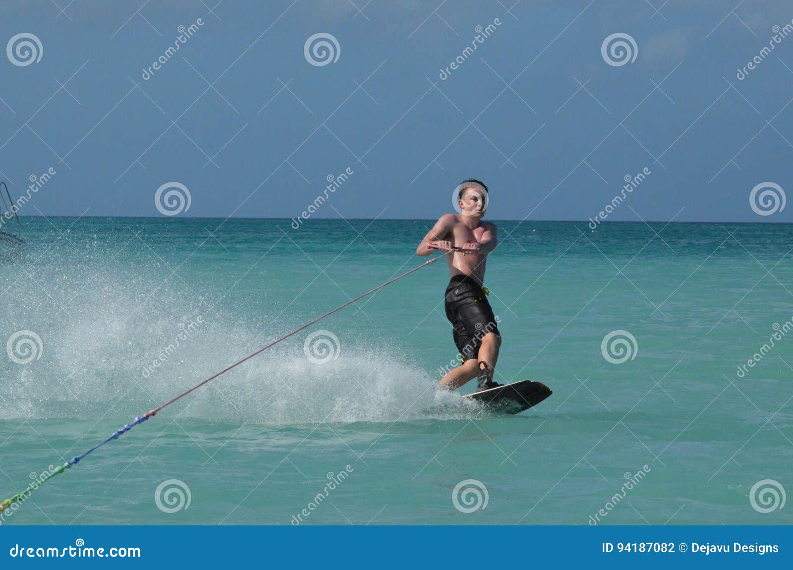 Young Man Wakeboarding in Tropical Waters of Aruba Stock Photo Image