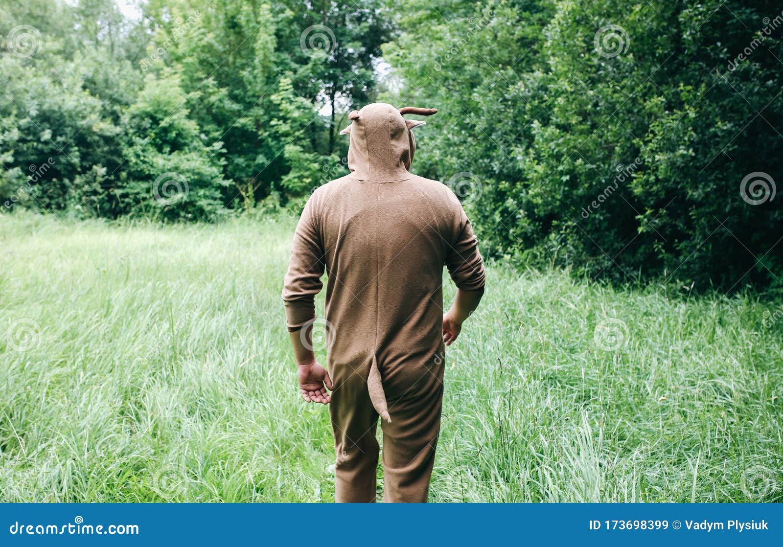 Young Man is Walking in the Forest in Cosplay Costume of a Cow. Guy in the  Funny Animal Pajamas Sleepwear in the Nature Stock Image - Image of  background, male: 173698399