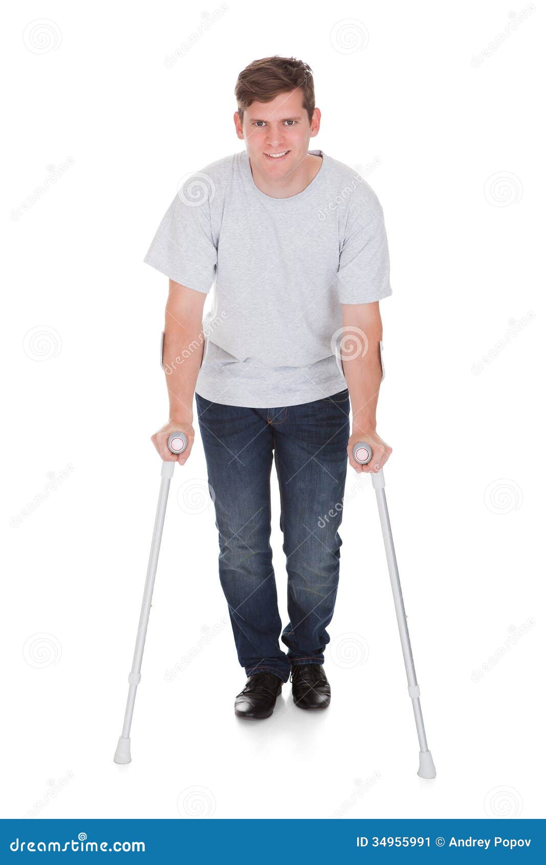 Young Man Walking with Two Crutches Stock Image Image of brown, male