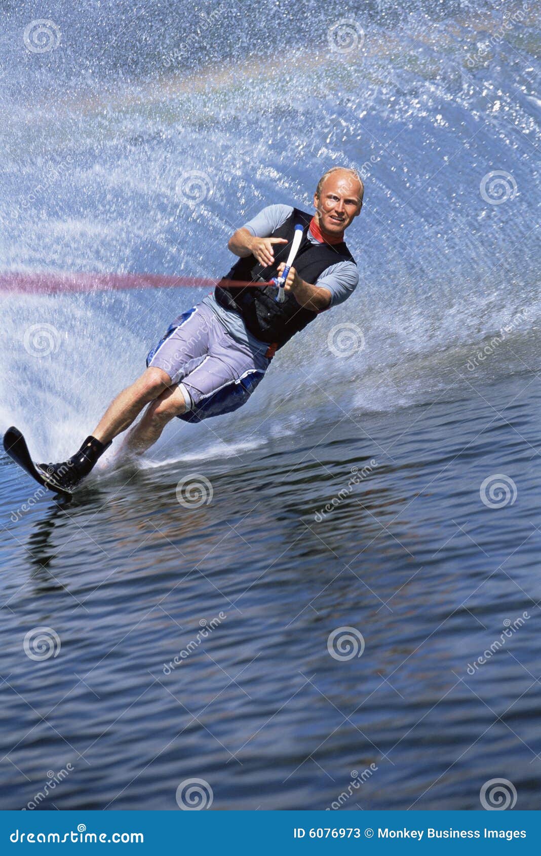 A young man water skiing stock image. Image of excitement 6076973