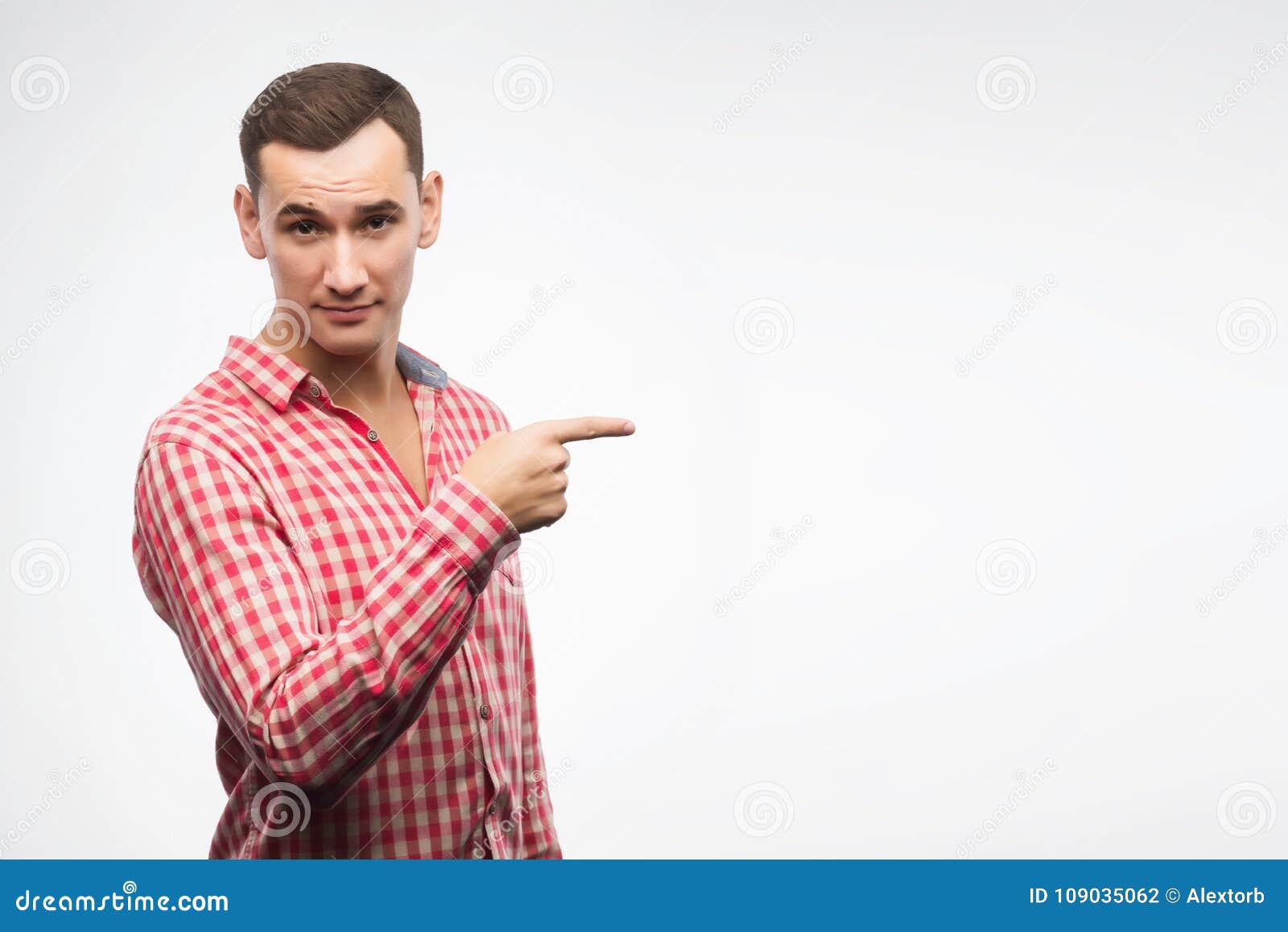 Young Man Wearing Checkered Red Shirt Points with His Finger To Stock ...