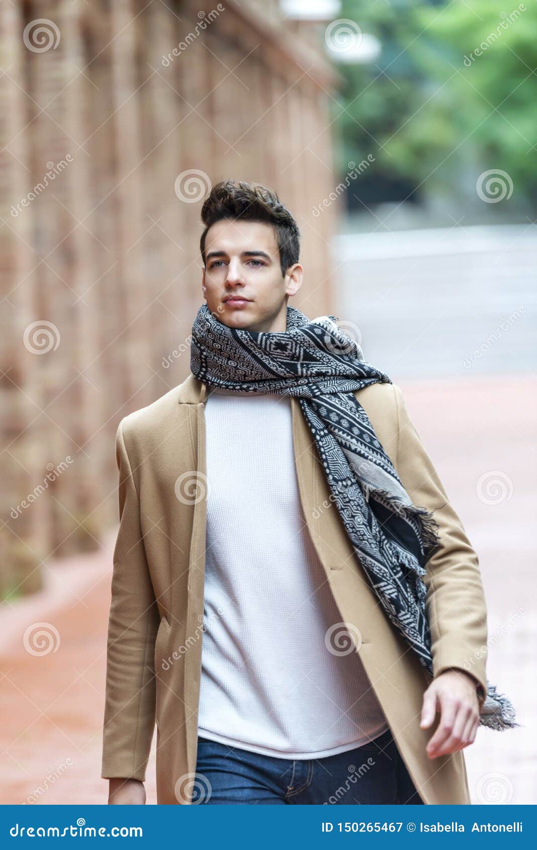 Young Man Wearing Winter Clothes in the Street. Young Guy with Modern  Hairstyle with Coat, Blue Jeans and White Sweeter Stock Image - Image of  adolescent, background: 150265467