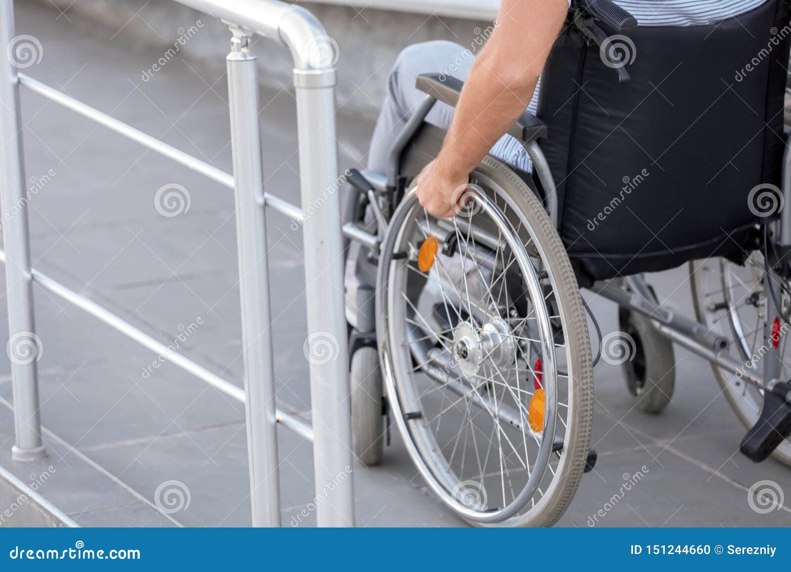 young man in wheelchair on ramp outdoors