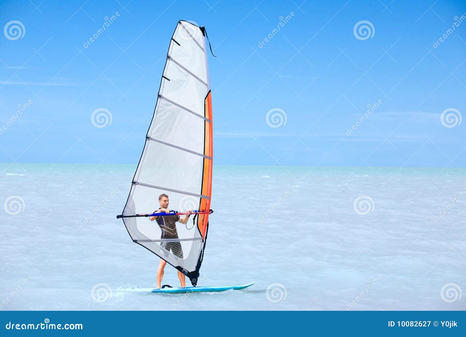young man on a windsurf