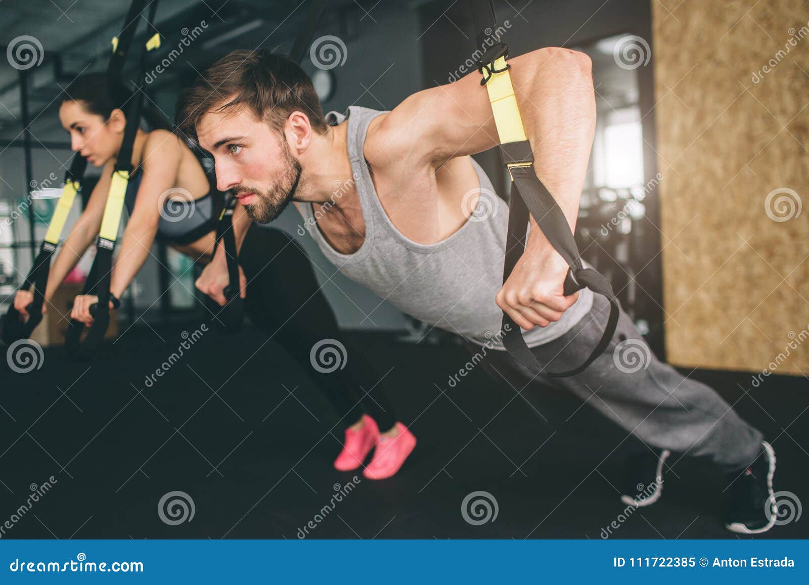 Young Man And Woman Are Doing Trx Chest Press Exercise He Is Doing Push Up While She Is Doing Oush Down Close Up Cut Stock Image Image Of Male Balance