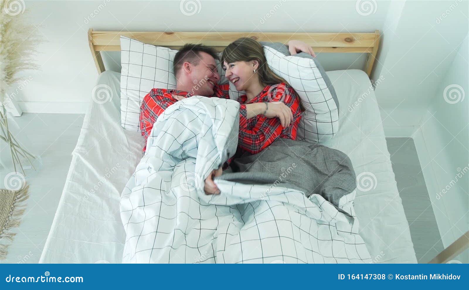 Young Man And Woman Fooling Around In Their Bed Stock Footage Video 
