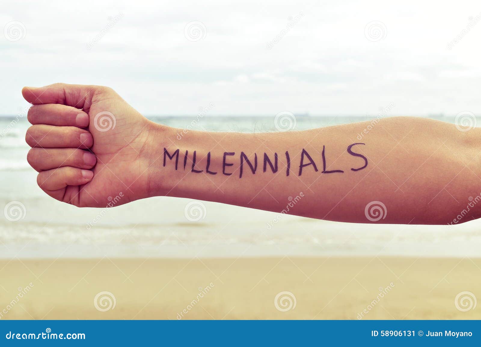 young man with the word millennials written in his arm