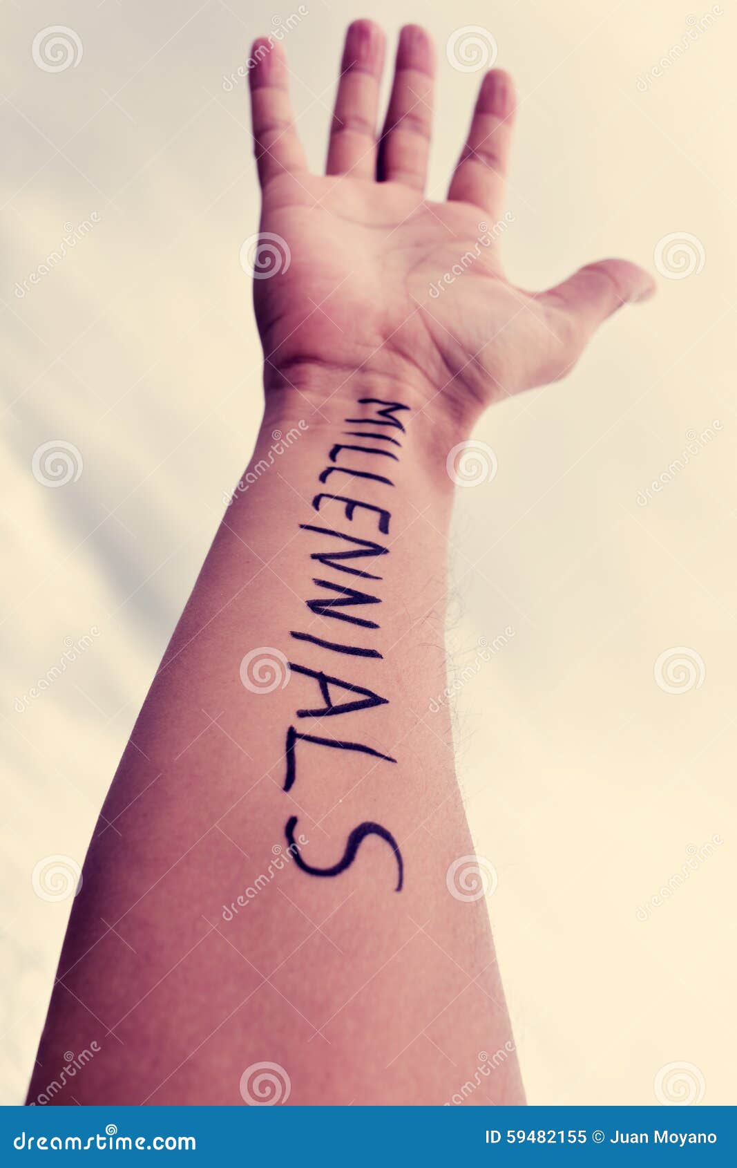 young man with the word millennials written in his arm, filtered