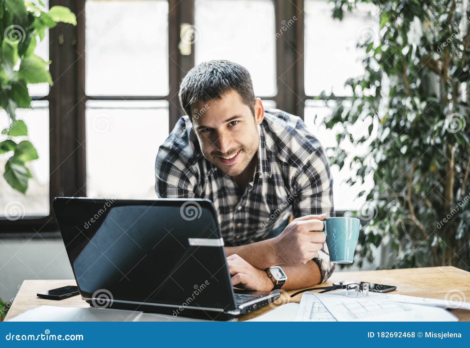 young man work remote in his cool home office. modern workspace studio for online business and freelance creative digital project
