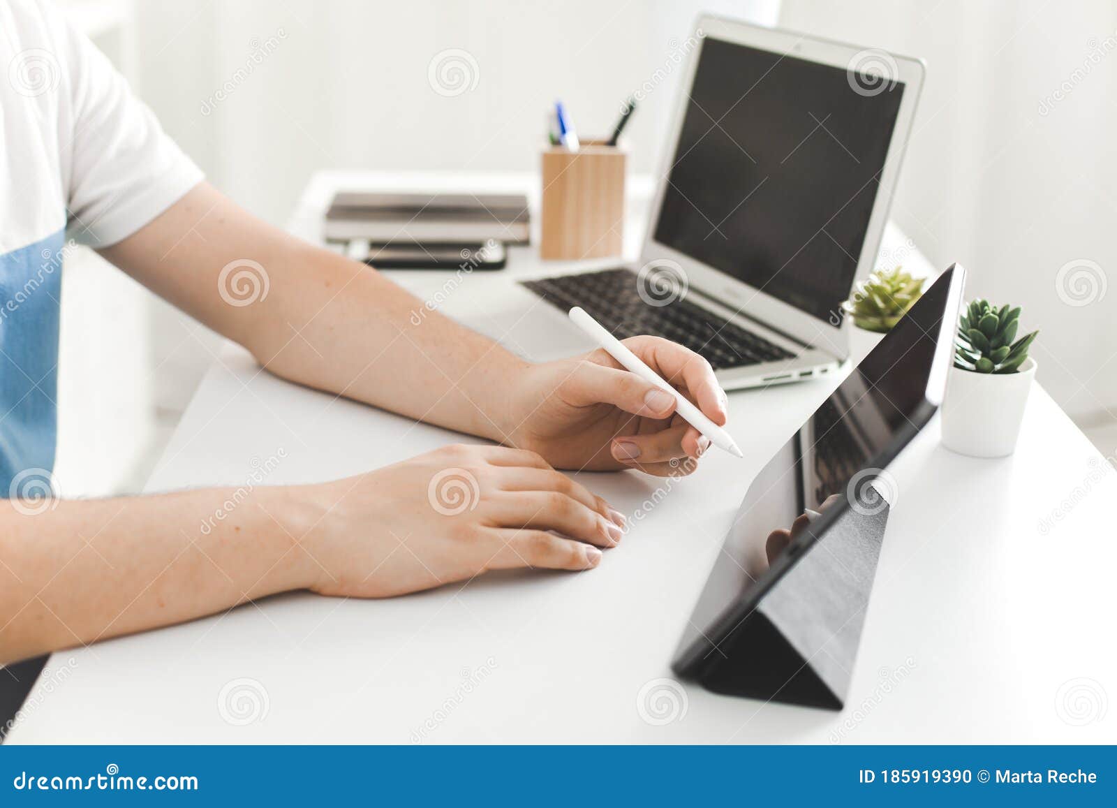 young man working on desk at home office business