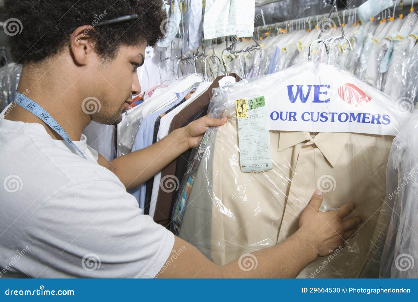 Young Man Working in Dry Cleaners Stock Photo Image of coathanger