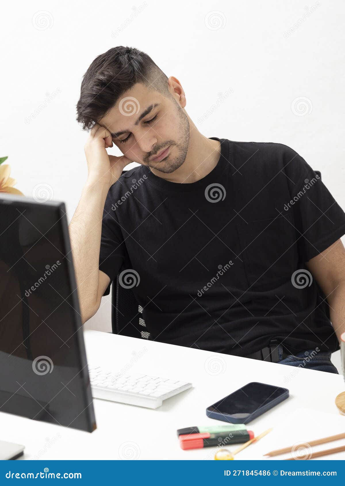 Young Man Working and Napping in His Home Office.education.business.e