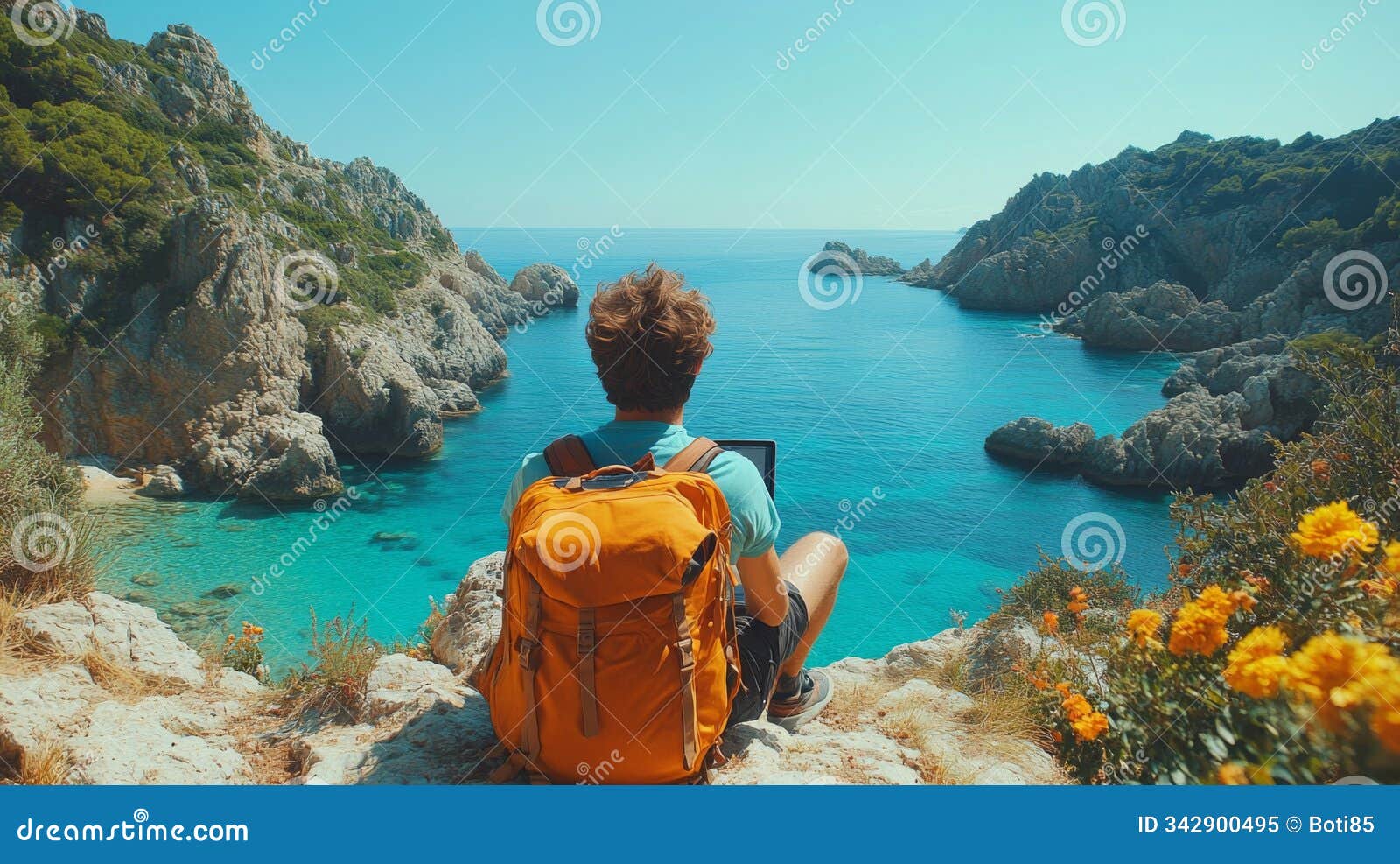 young man working remotely on laptop while embracing the stunning ocean view