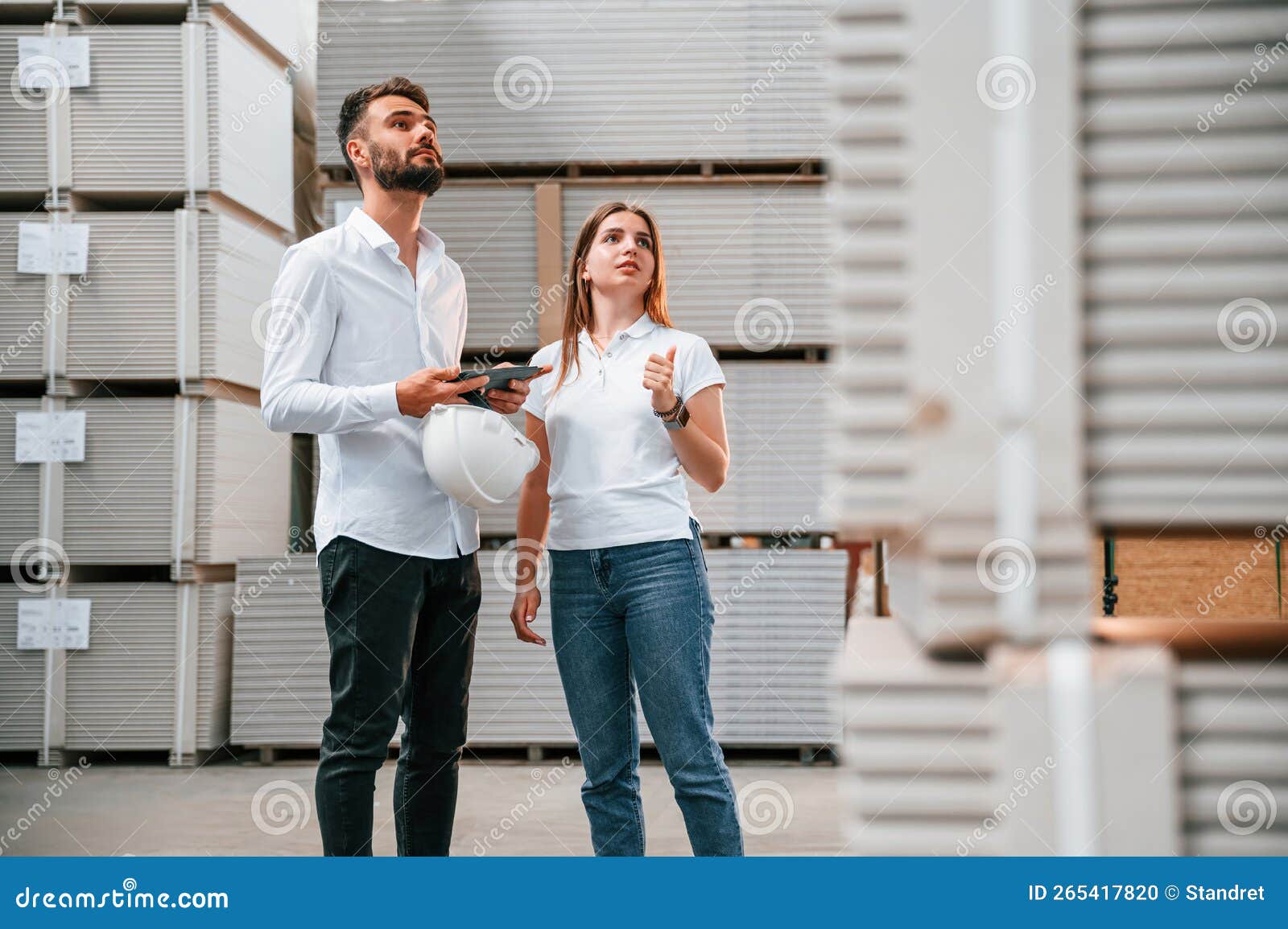 Young Manager in Formal Clothes is Working with Woman in the Warehouse Stock Photo Image of