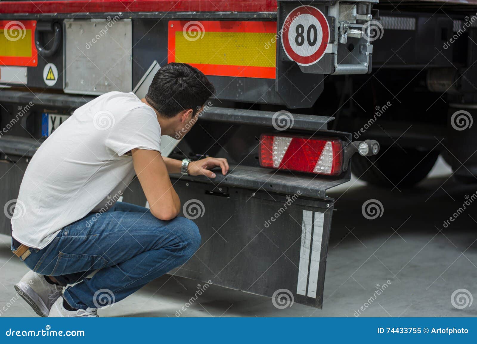 Young Mechanic Inspecting Freight Truck Stock Image