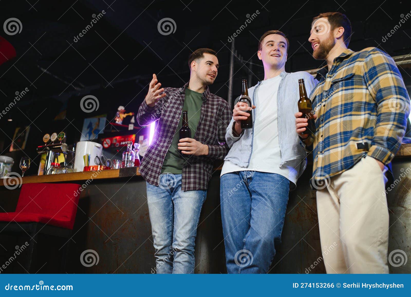 young men casual clothes talking laughing drinking sitting bar counter pub young men casual clothes 274153266