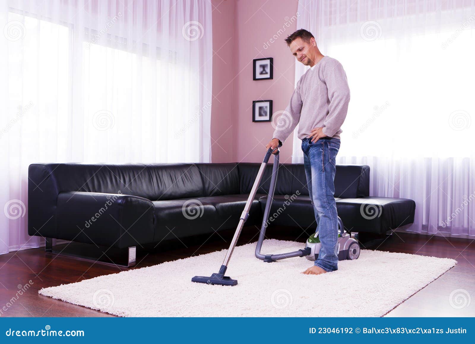 Young Men Living in the Vacuum. Stock Photo Image of home, floor