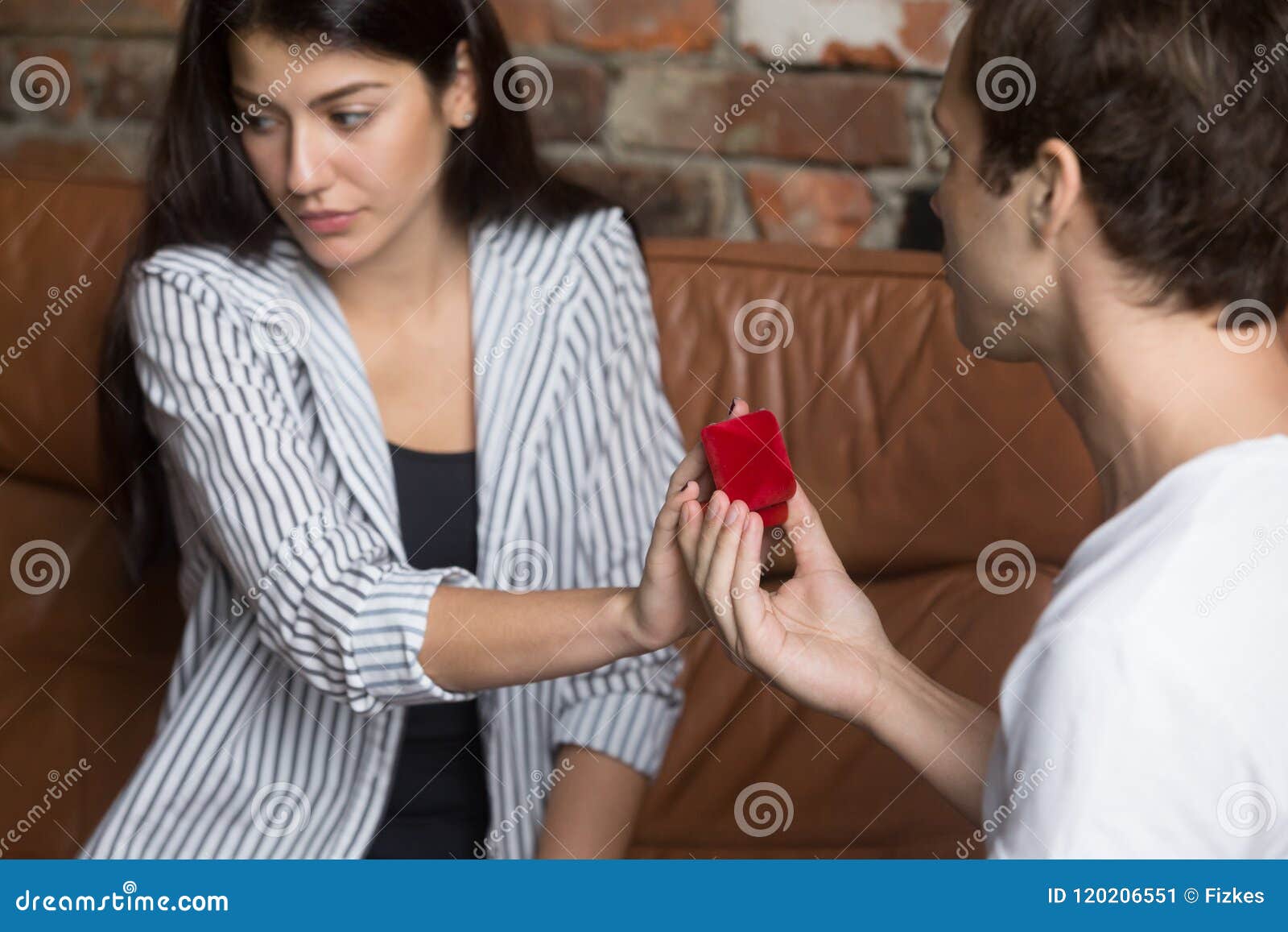 unhappy girl refusing to marriage proposal of boyfriend