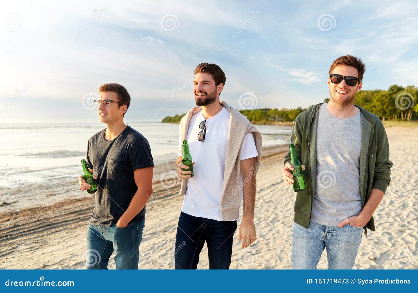 Young Men with Non Alcoholic Beer Walking on Beach Stock Image - Image ...