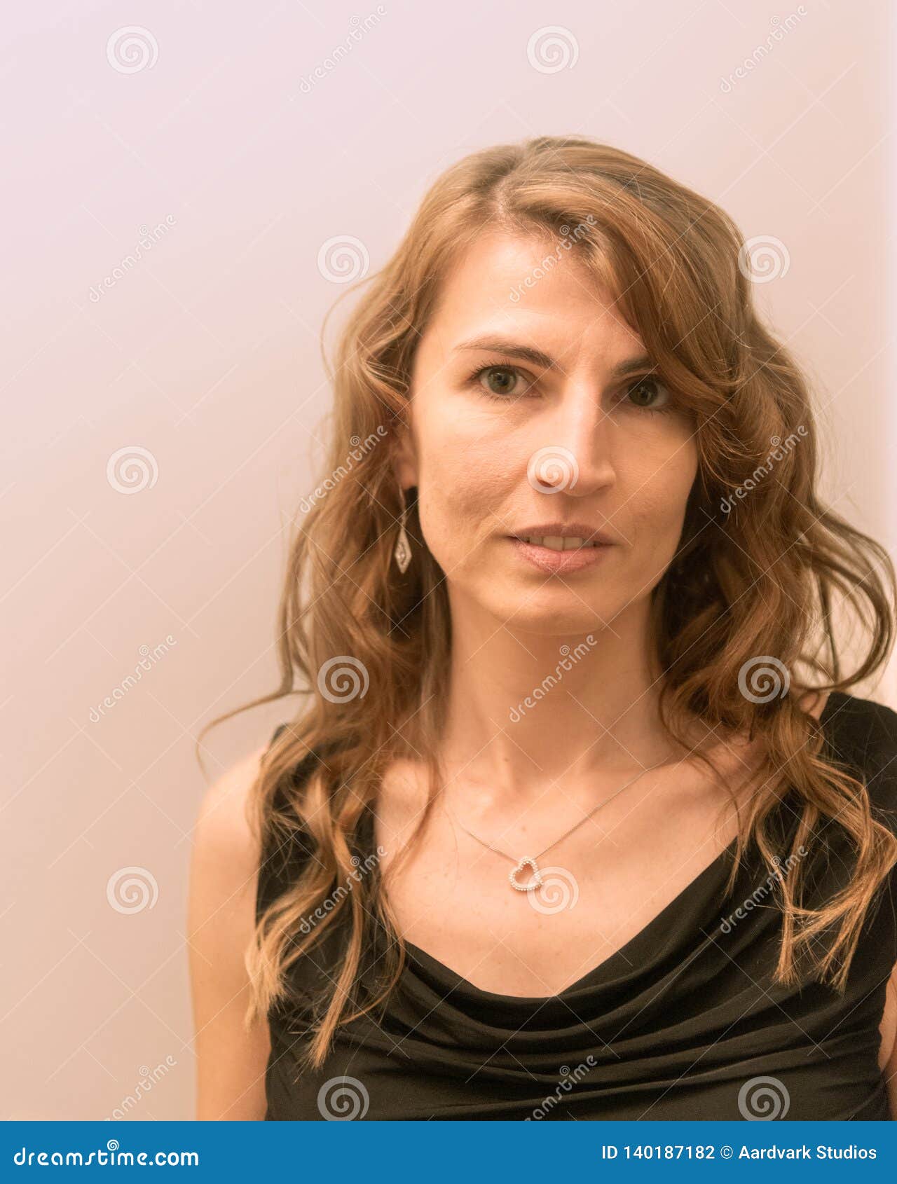 Young Middle Aged White Woman with Hairstyle Smiling Wearing Black