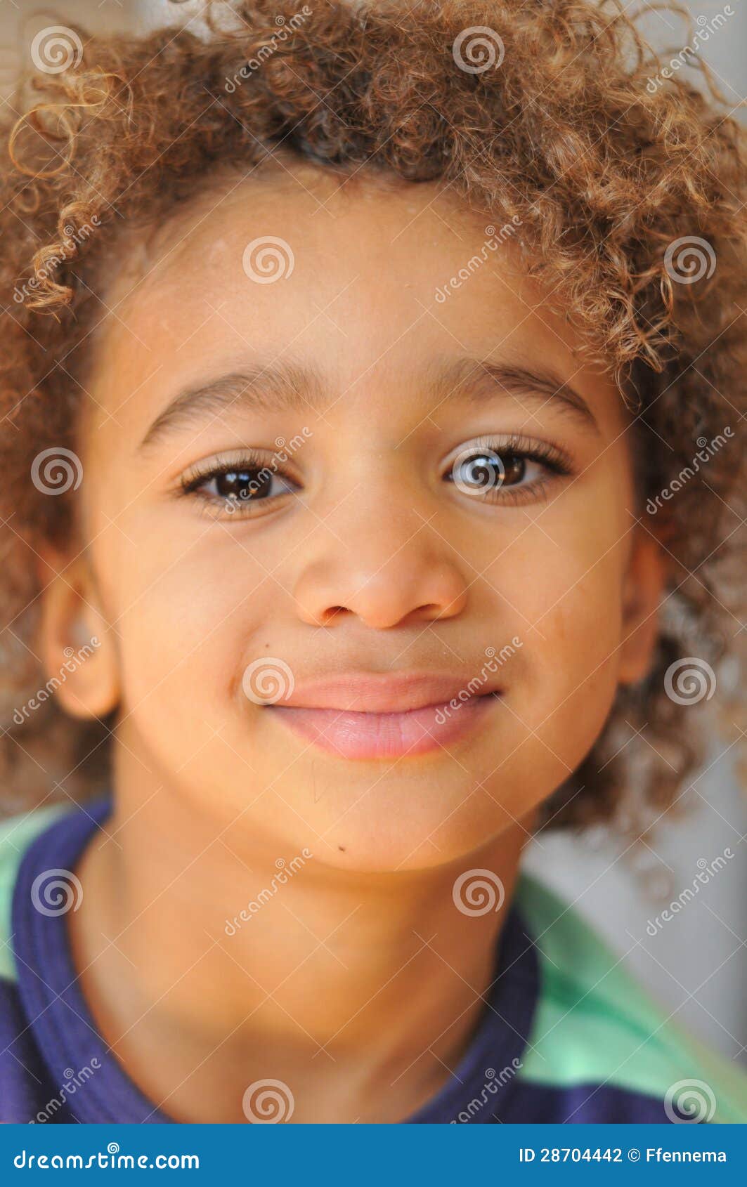 young mixed race boy with curly hair stock photo - image of