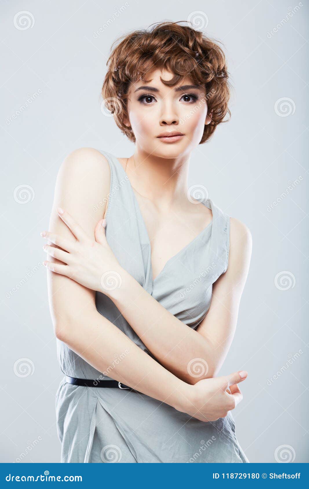 Young Model with Short Curly Hair Posing in Fashion Style at St Stock Photo  - Image of background, elegance: 118729180