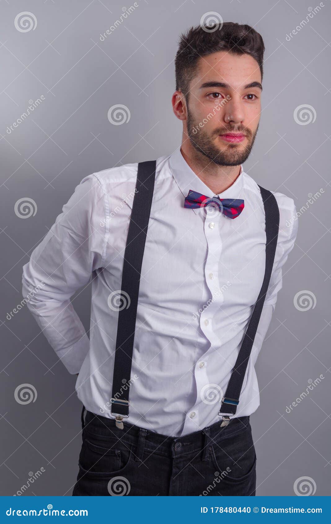 Young Model in White Shirt, Suspenders, Bow Tie, Piercings and ...