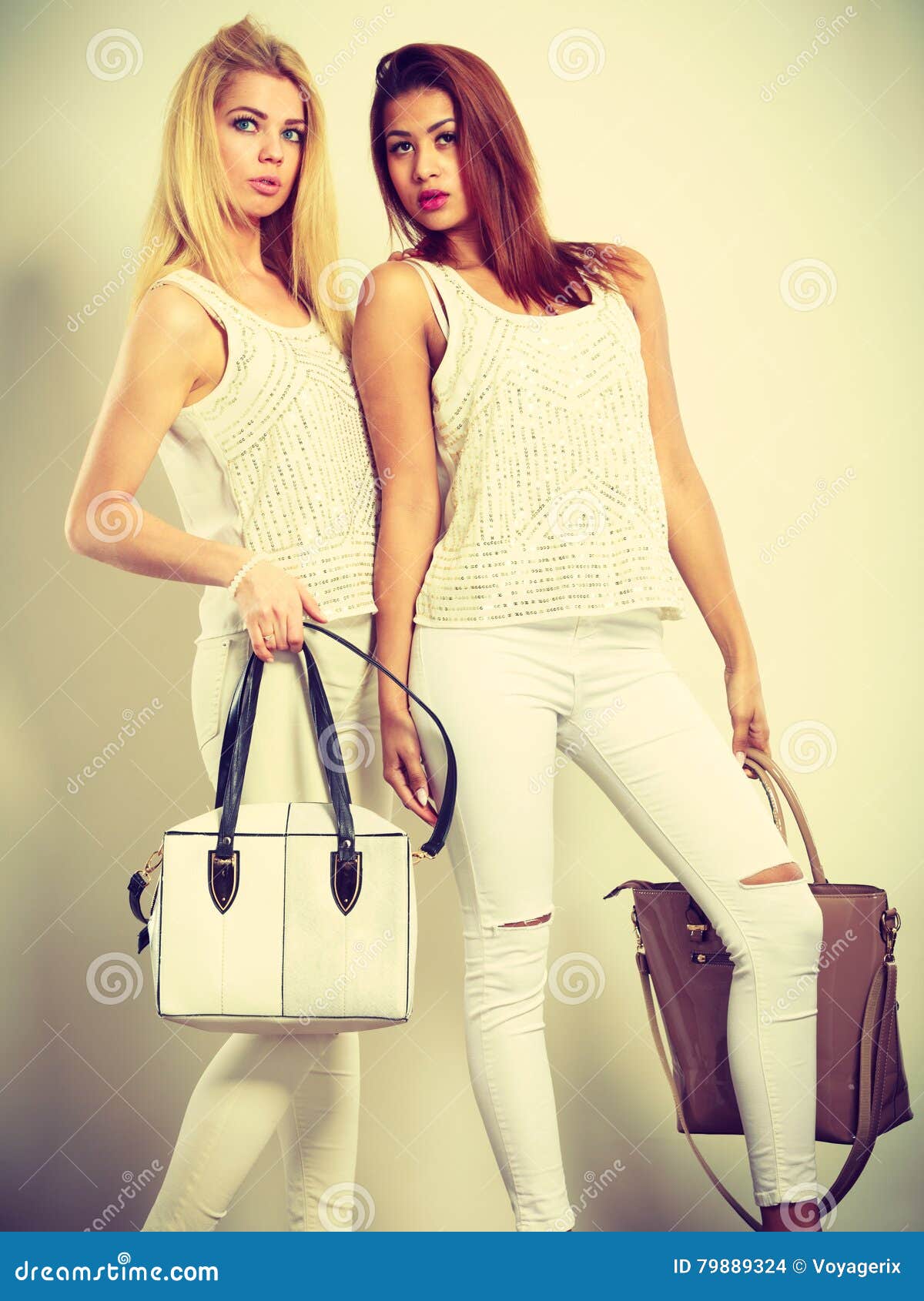 Fashion models with bag Stock Photo by ©nelapsiart 81979174