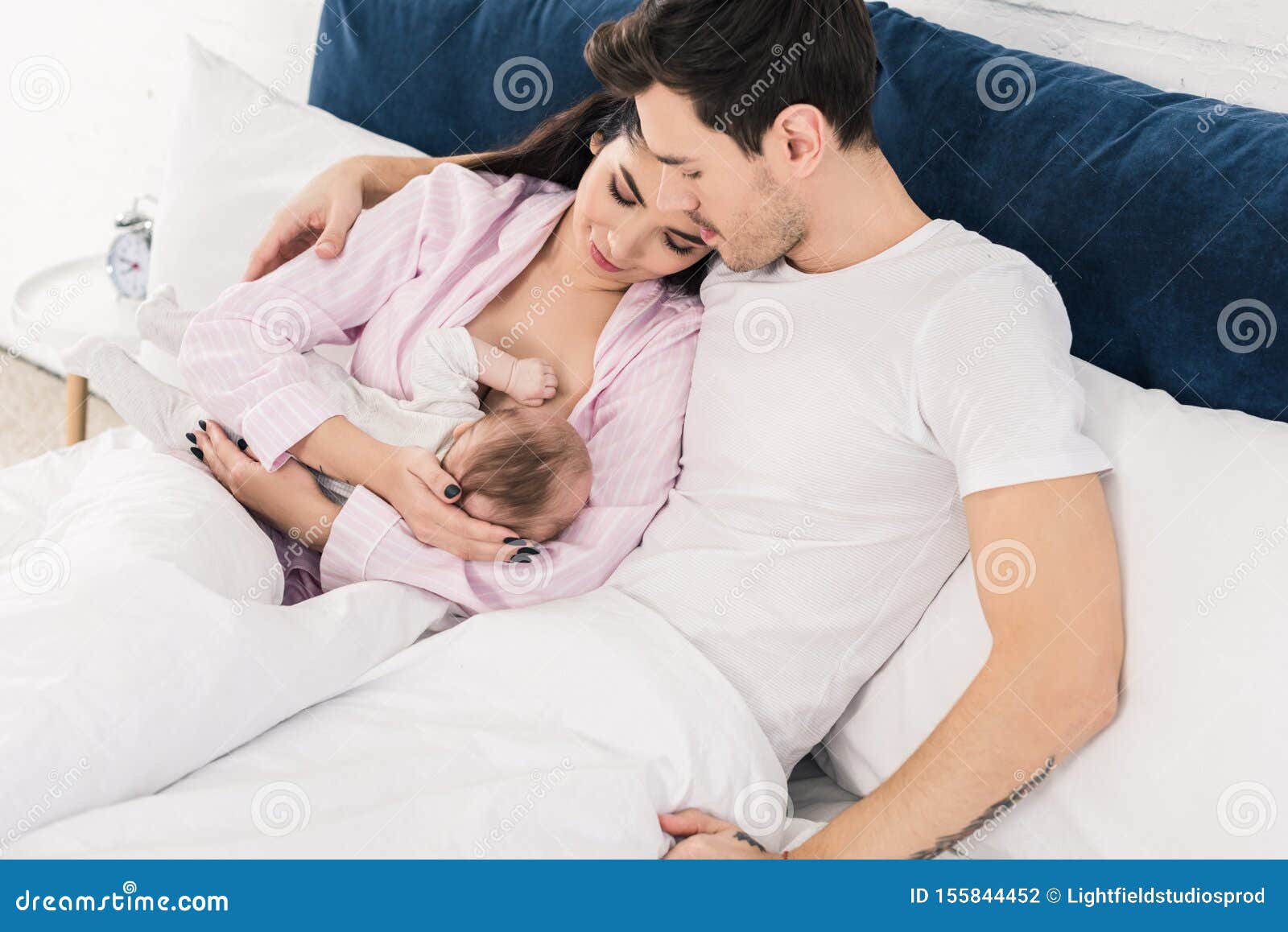 Woman Breastfeeding Husband Stock Photos