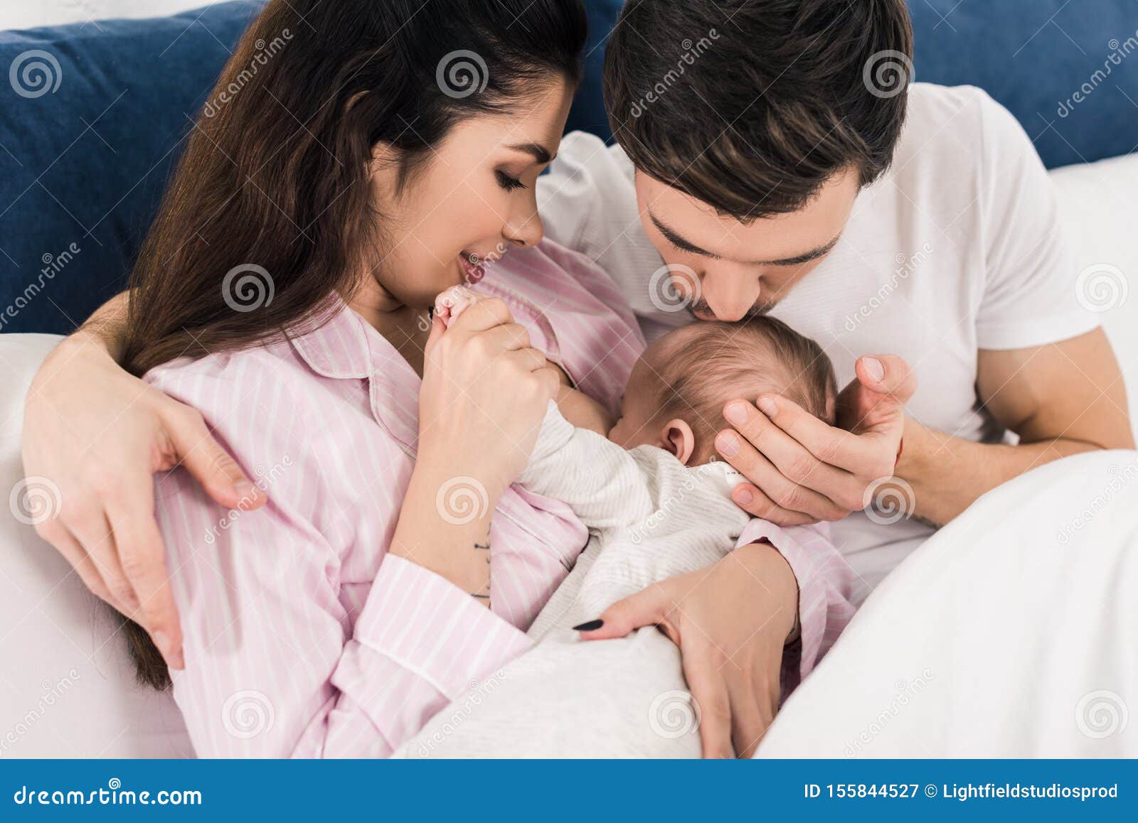 Woman Breastfeeding Husband Stock Photos