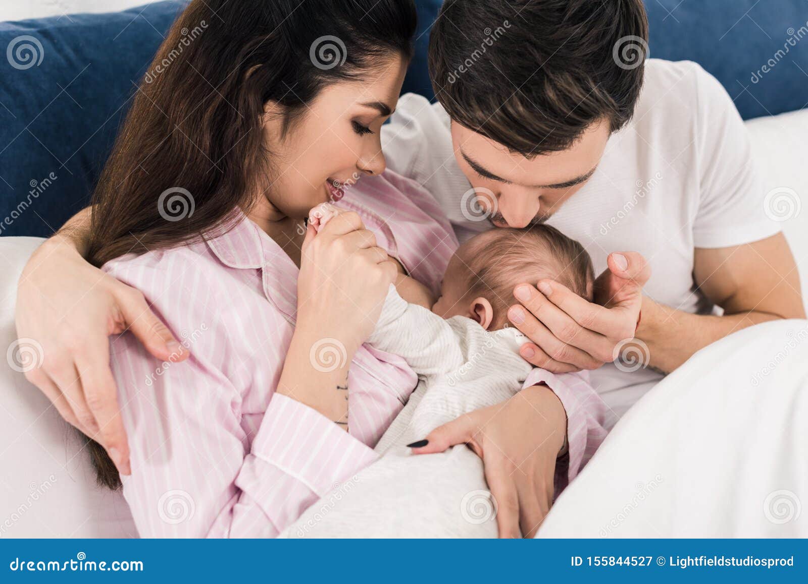 Woman Breastfeeding Husband Stock Photos photo