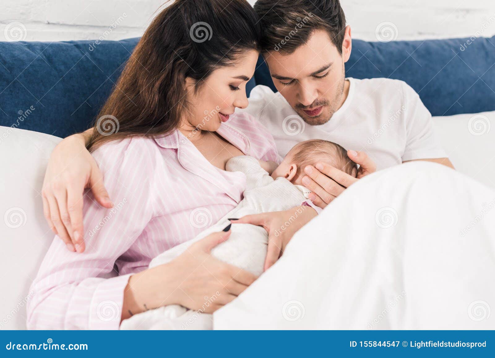 Woman Breastfeeding Husband Stock Photos pic