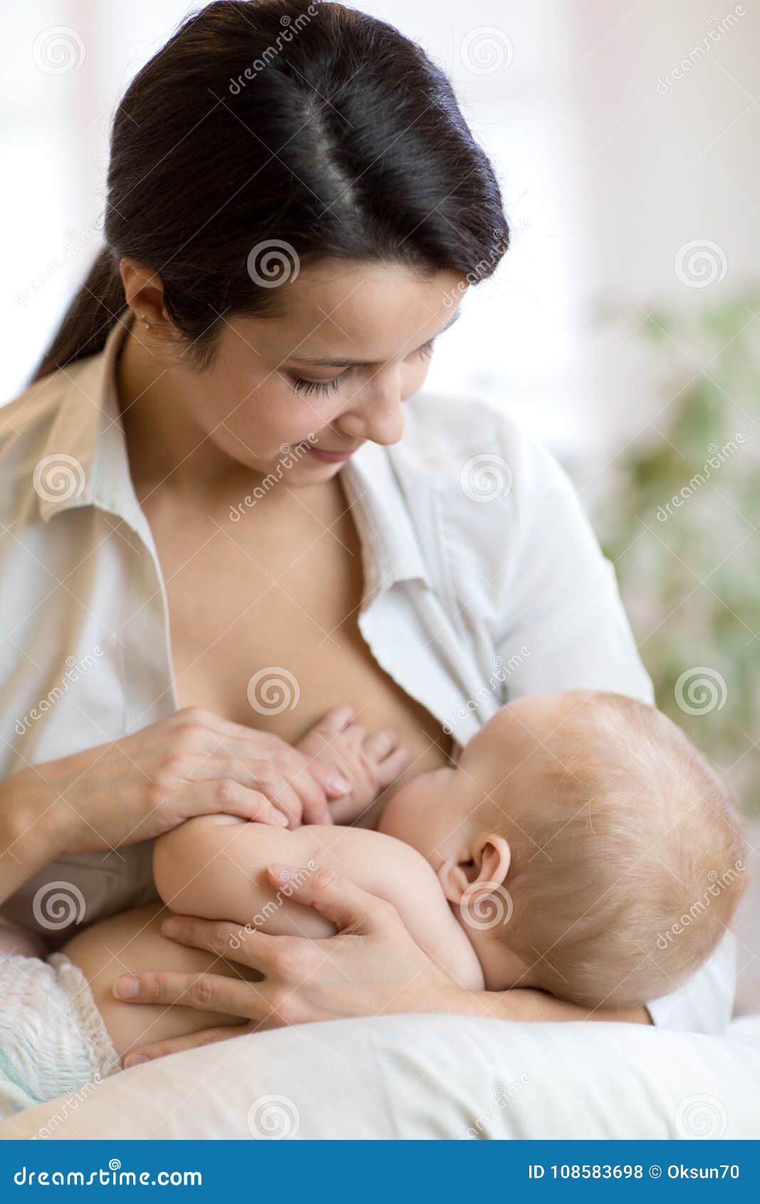 woman breastfeeding babies