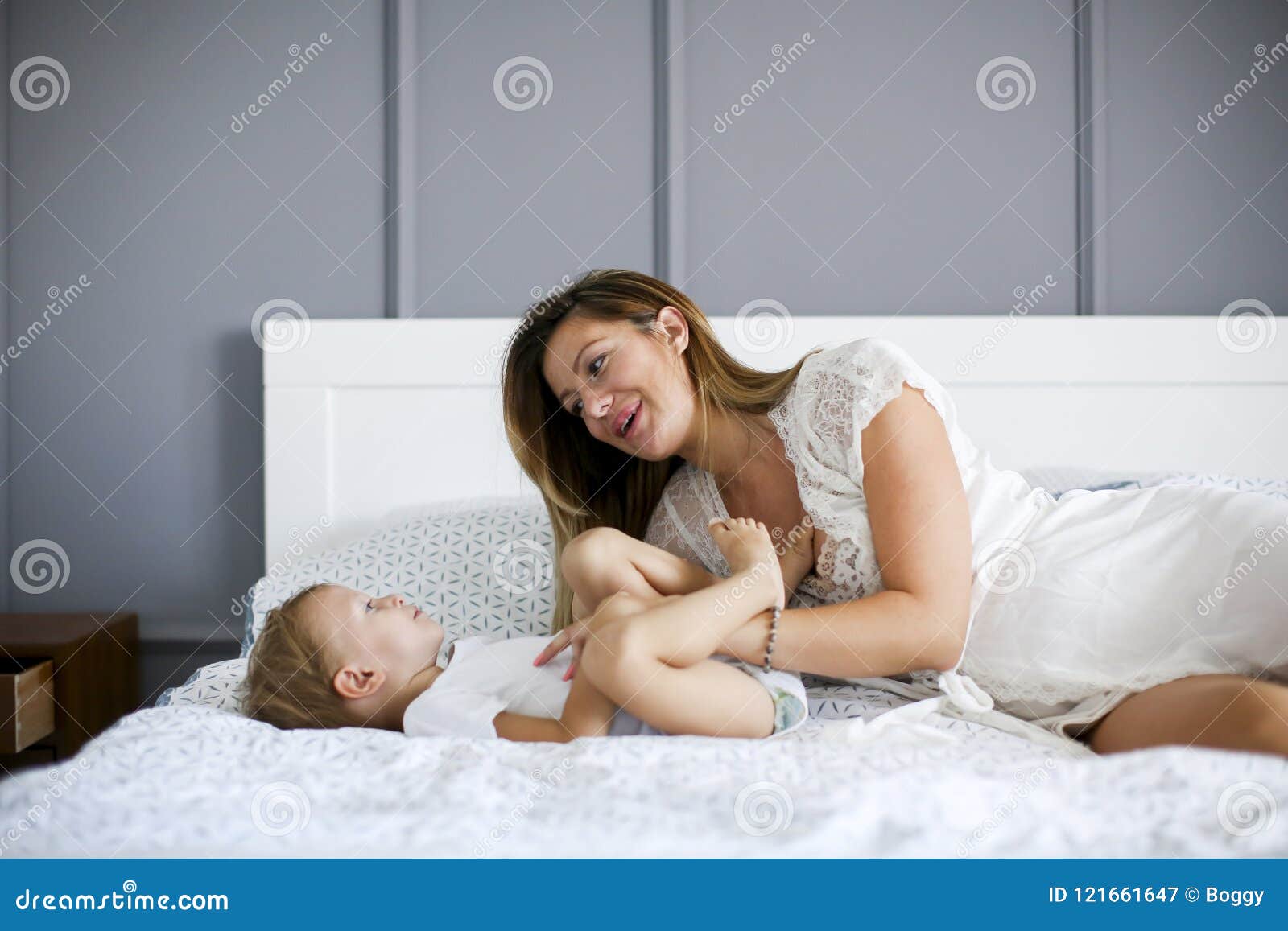 Young Mother With Son In The Bed Stock Image Image Of Indoor Laugh