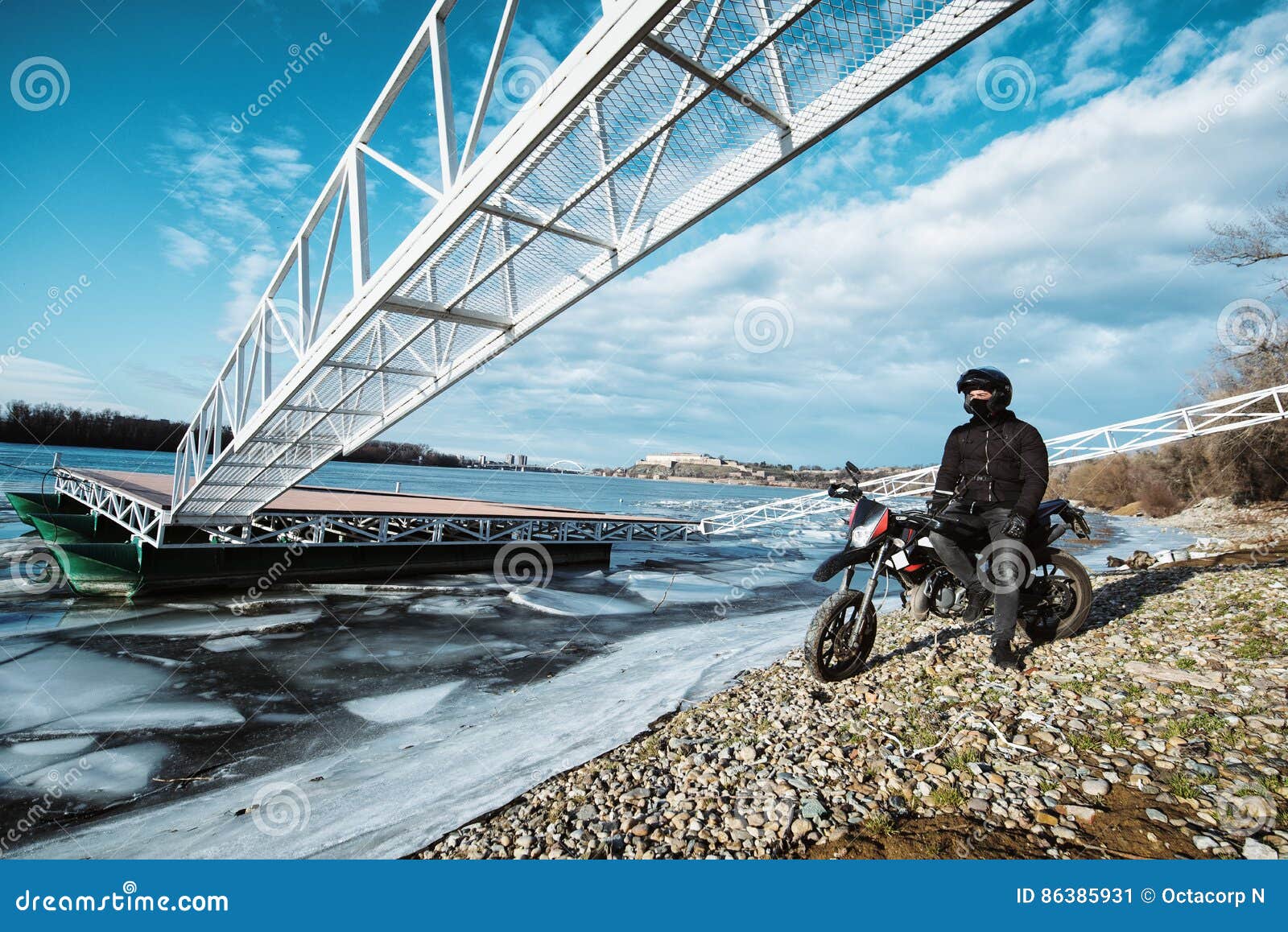 A Young Motorcycle Enthusiast Enjoying a Beautiful View of a Fr Stock