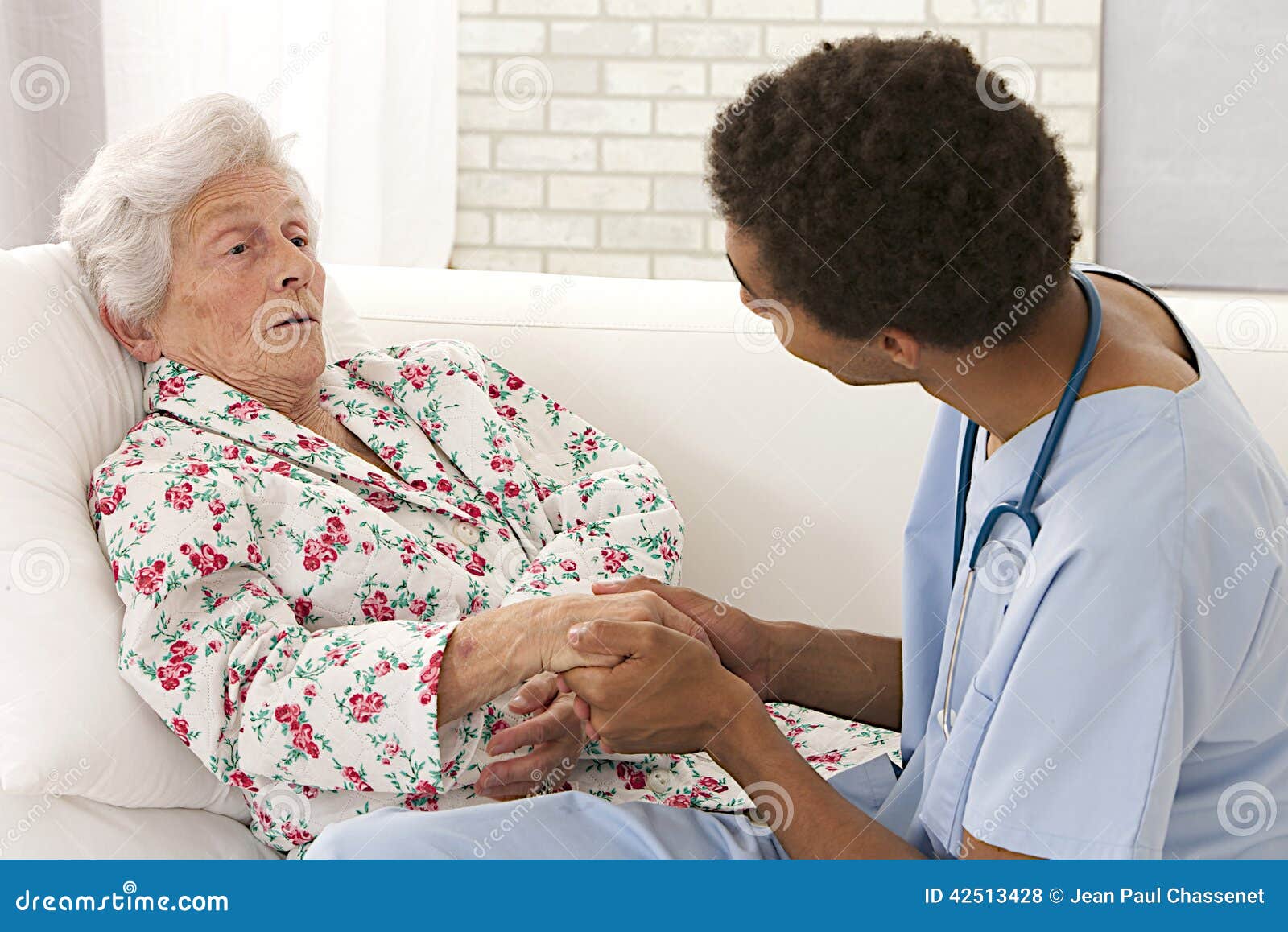 young mulatto doctor caring about a very old female patient