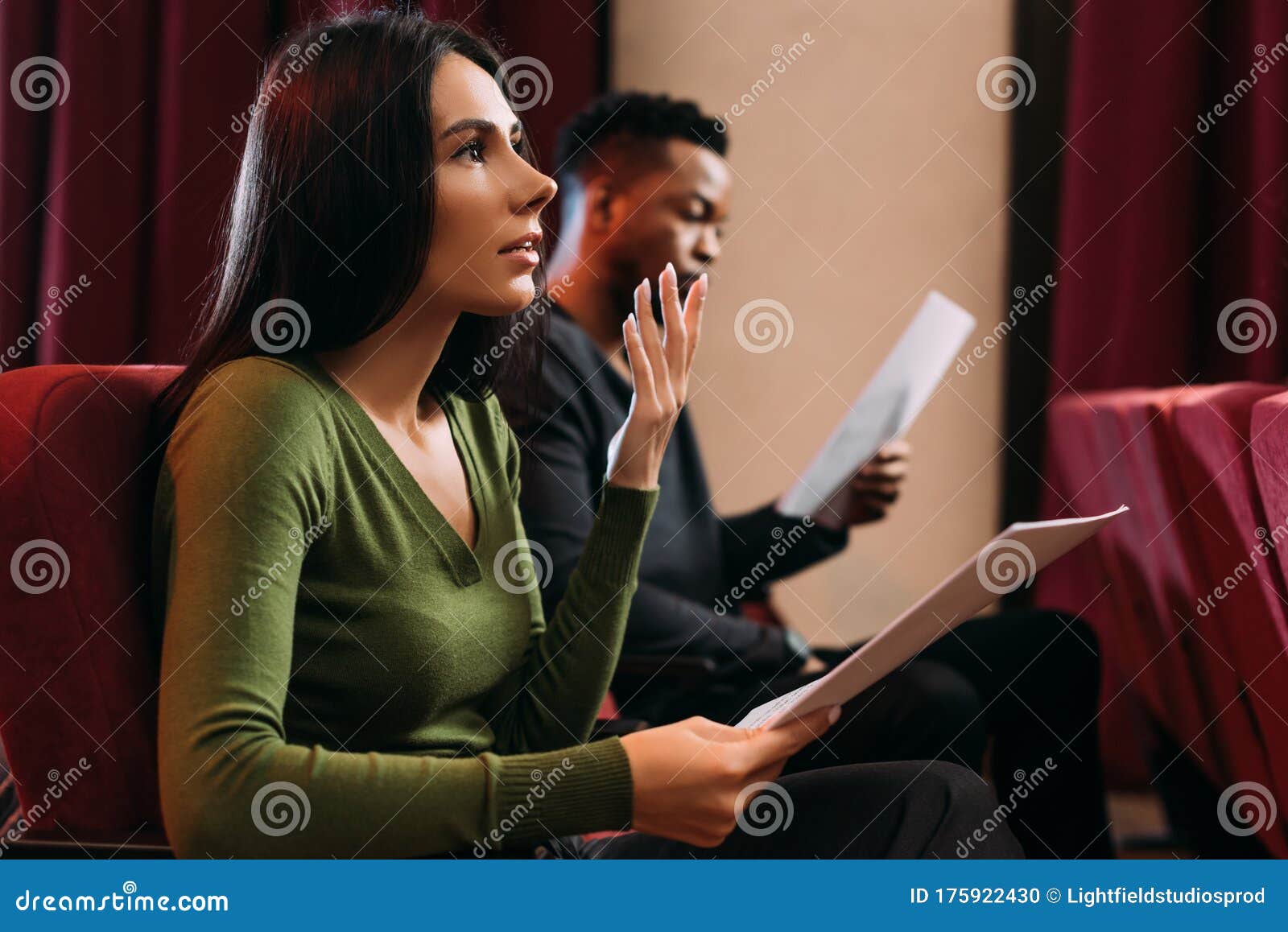 multicultural actor and actress reading scripts
