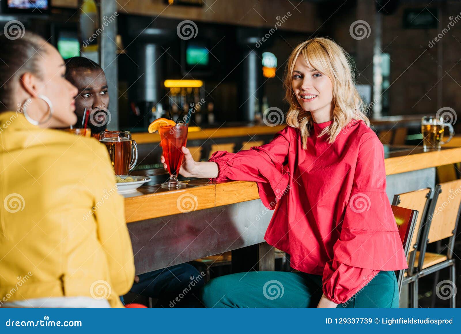 Young Multiethnic Friends Spending Time in Bar and Drinking Stock Image ...