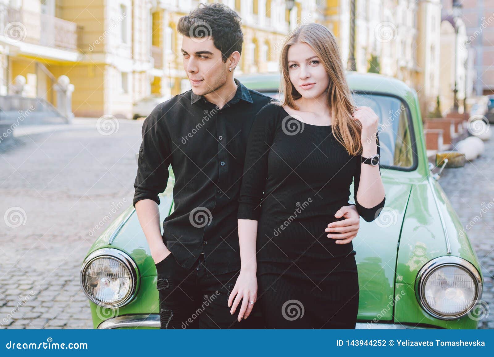Couple of models posing in street style autumn outfit, on grey - Stock  Photo - Dissolve